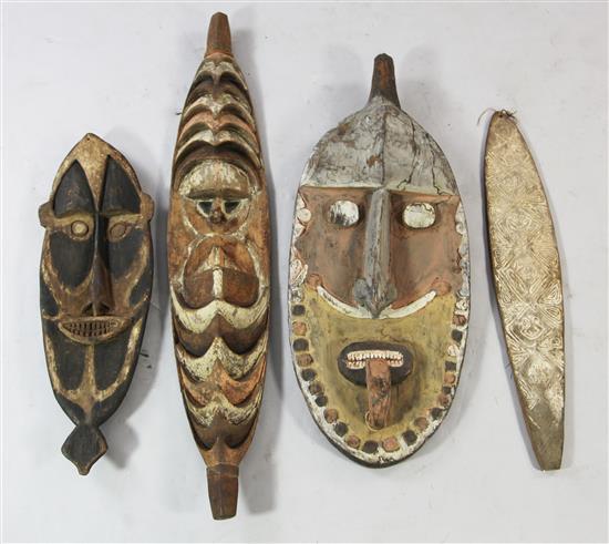 Three Sepik River tribal ancestor boards and a bullroarer